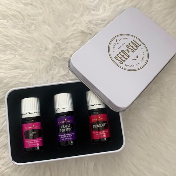 Trio of young living oils in tin container